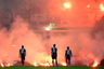 DUESSELDORF, GERMANY - MAY 15: Flares burn next to Ronny of Berlin and team mates during the Bundesliga Relegation second leg match between Fortuna Duesseldorf and Hertha BSC Berlin at Esprit-Arena on May 15, 2025 in Duesseldorf, Germany. (Photo by Lars Baron/Bongarts/Getty Images)